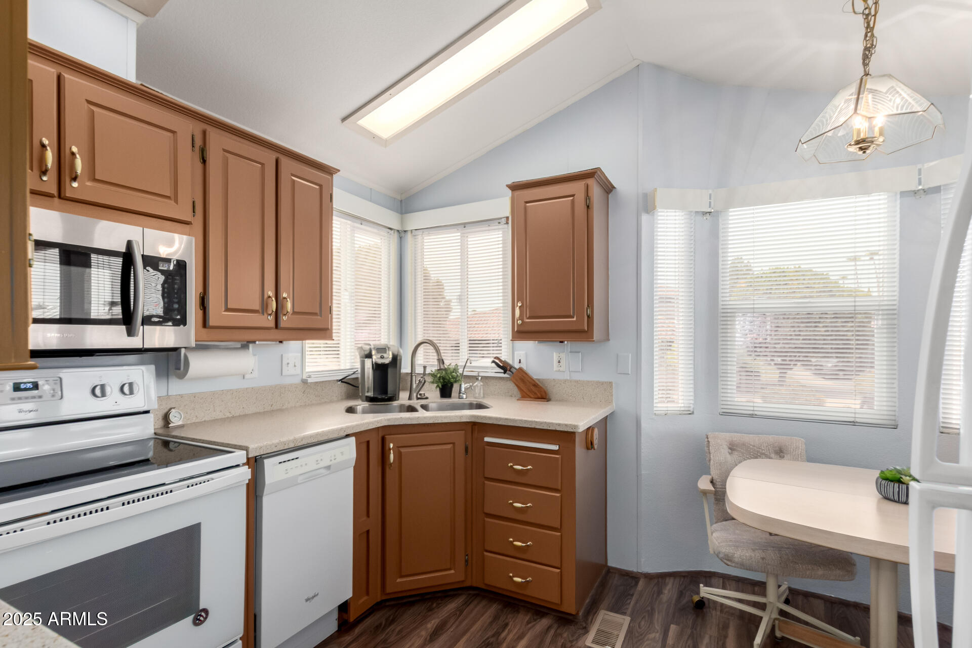 111 South Greenfield Road, Unit 480 Mesa, AZ 85206 - Photo 10 of 29 a kitchen with a sink stove and microwave