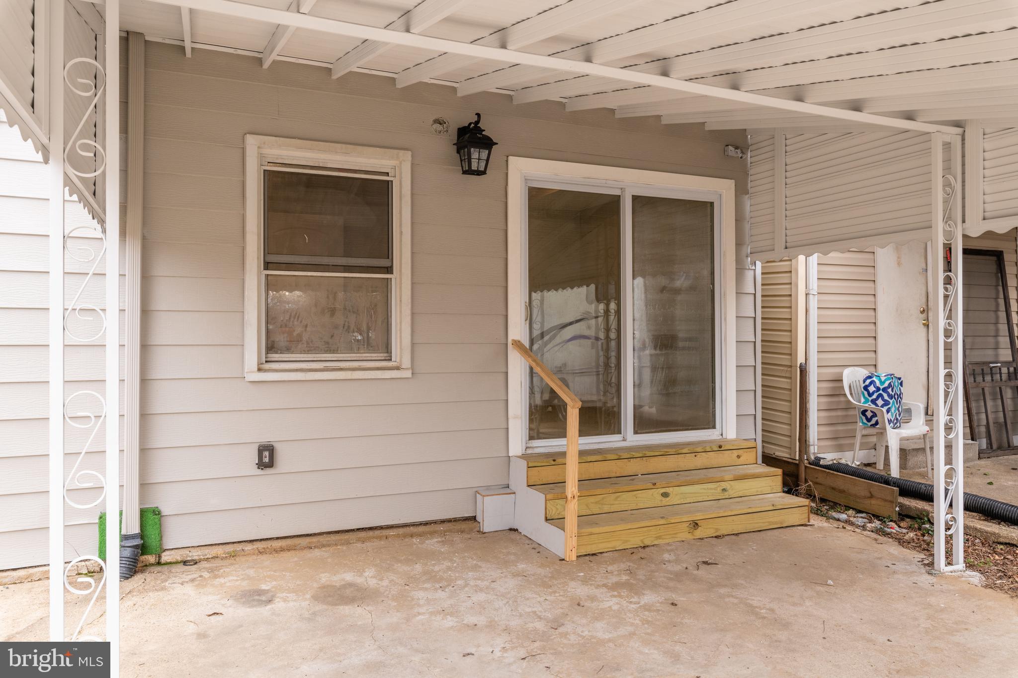 2407 Naylor Road Southeast Washington, DC 20020 - Photo 26 of 37 Rear view to bedroom 4 & covered patio/parking