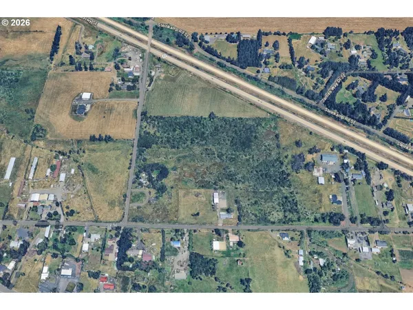 an aerial view of a residential houses with outdoor space