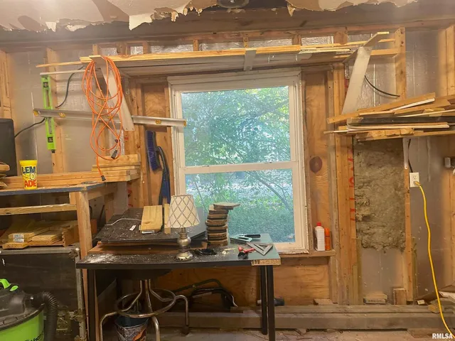 a view of a workspace with furniture