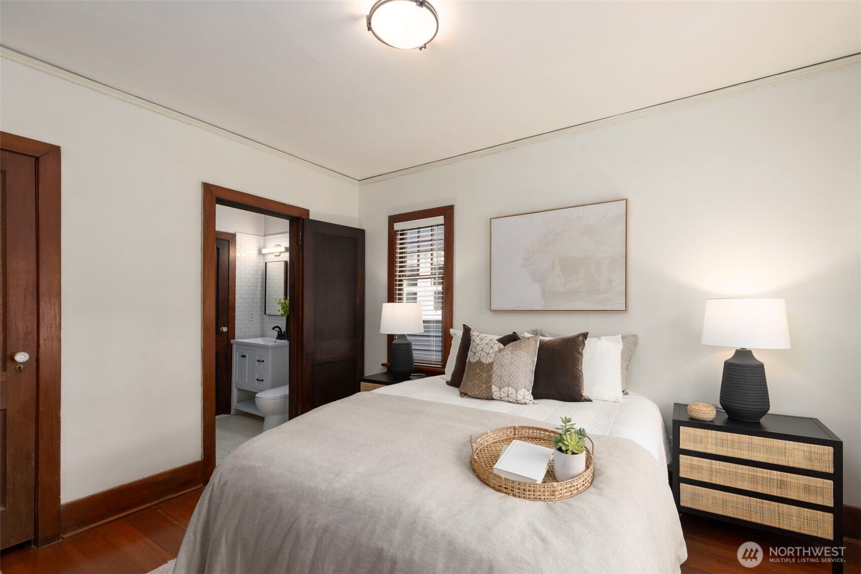 1815 29th Avenue South Seattle, WA 98144 - Photo 15 of 25 a bedroom with a bed and a lamp