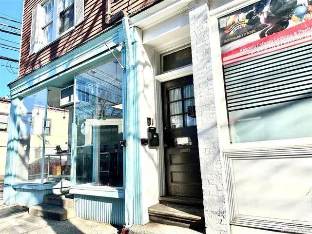 a view of a building with a door and a window