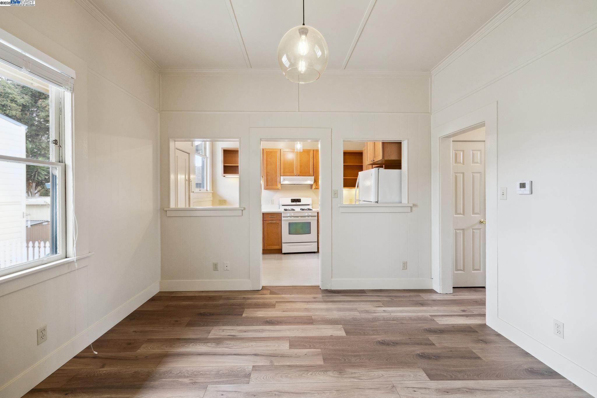1820 3rd Street Alameda, CA 94501 - Photo 32 of 60 a view of a livingroom with wooden floor and windows