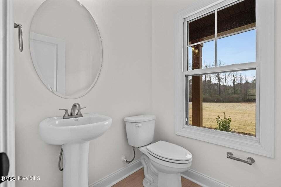 Tbd Doubs Chapel Road Carthage, NC 28327 - Photo 25 of 38 a bathroom with a sink toilet and a mirror