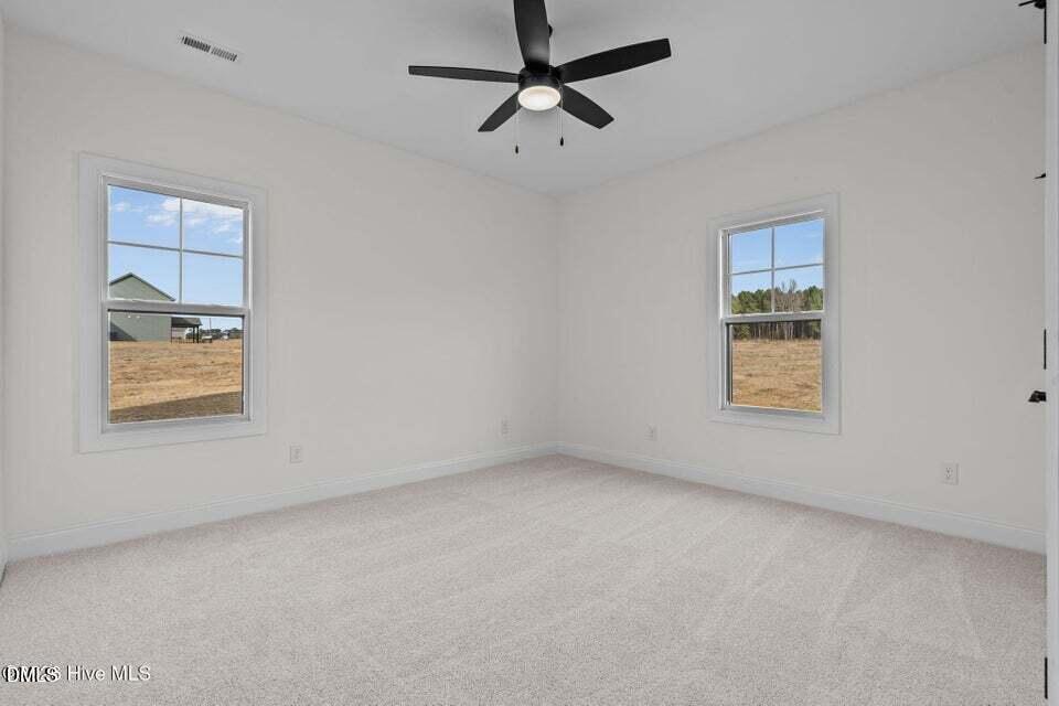 Tbd Doubs Chapel Road Carthage, NC 28327 - Photo 26 of 38 an empty room with a window and ceiling fan