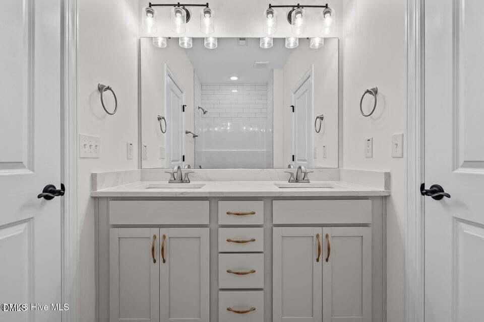 Tbd Doubs Chapel Road Carthage, NC 28327 - Photo 27 of 38 a bathroom with double vanity sinks and a mirror
