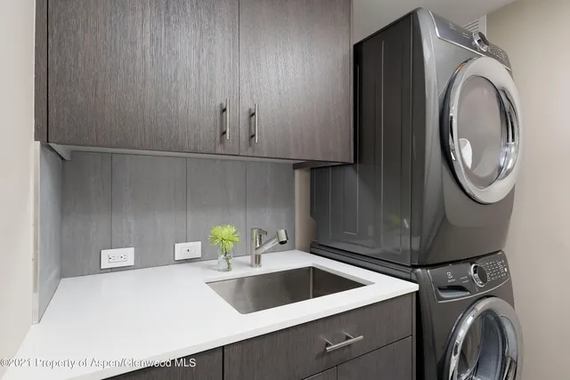 a view of storage and utility room with washer and dryer