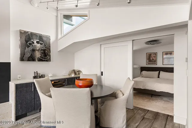 a bedroom with a bed and a couch