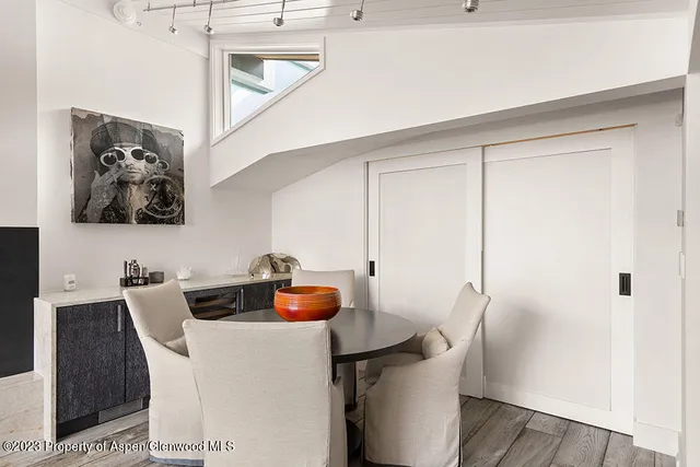a dining room with a table and chairs