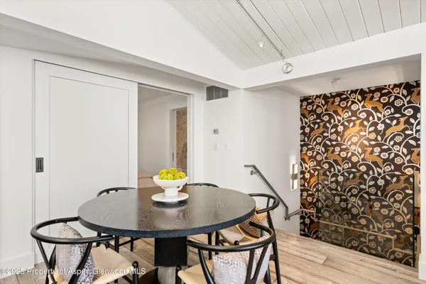a bathroom with a granite countertop sink mirror and shower