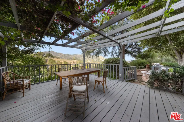 a view of a chairs and table on the wooden floor