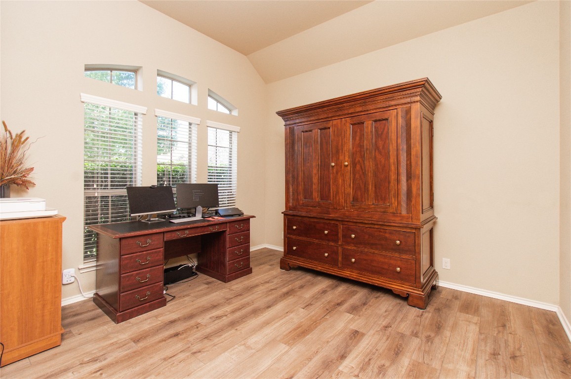 947 Madrone Drive Georgetown, TX 78628 - Photo 17 of 32 a room with a bed and a dresser