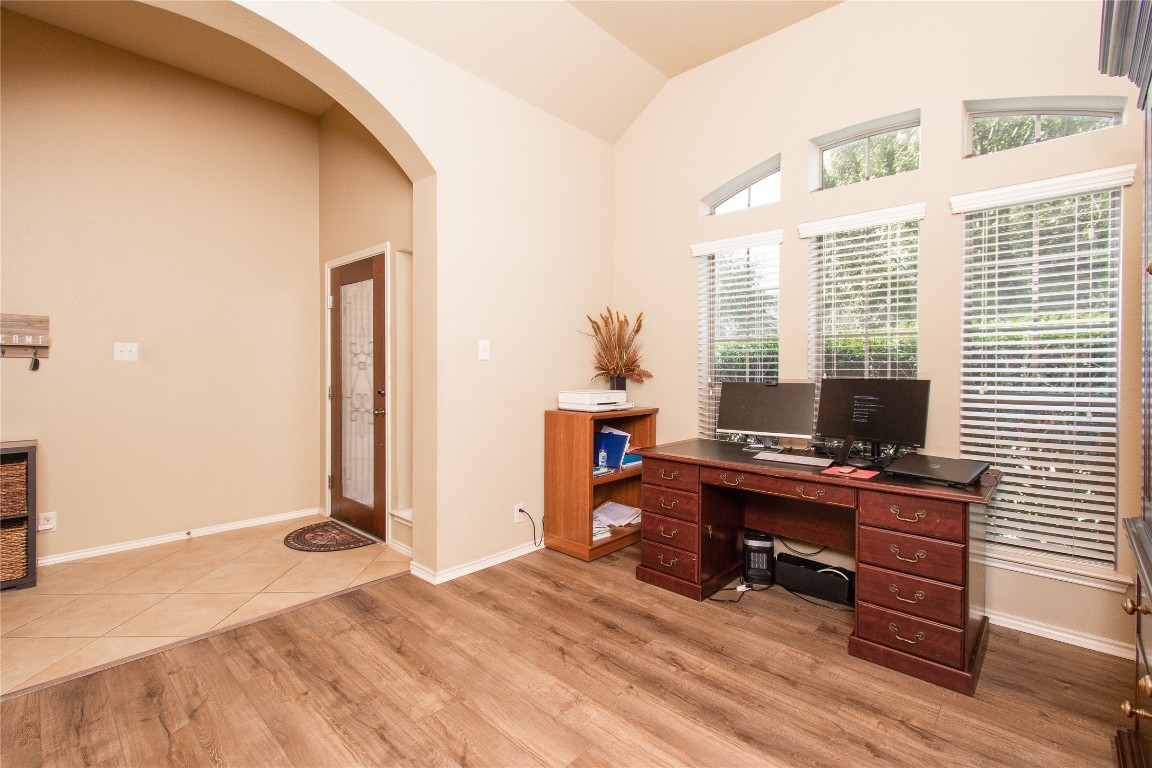 947 Madrone Drive Georgetown, TX 78628 - Photo 18 of 32 a view of a workspace with furniture and a window