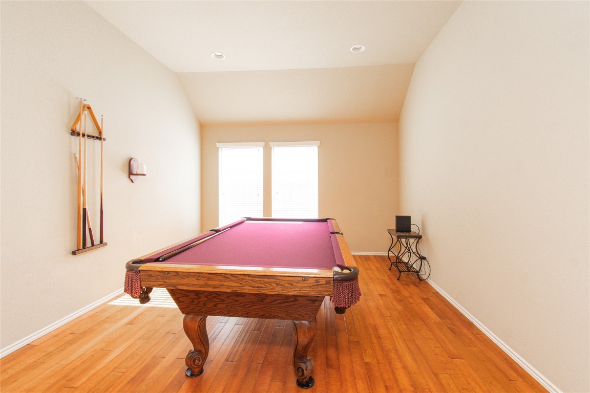 947 Madrone Drive Georgetown, TX 78628 - Photo 19 of 32 a room with a bed and a wooden floor
