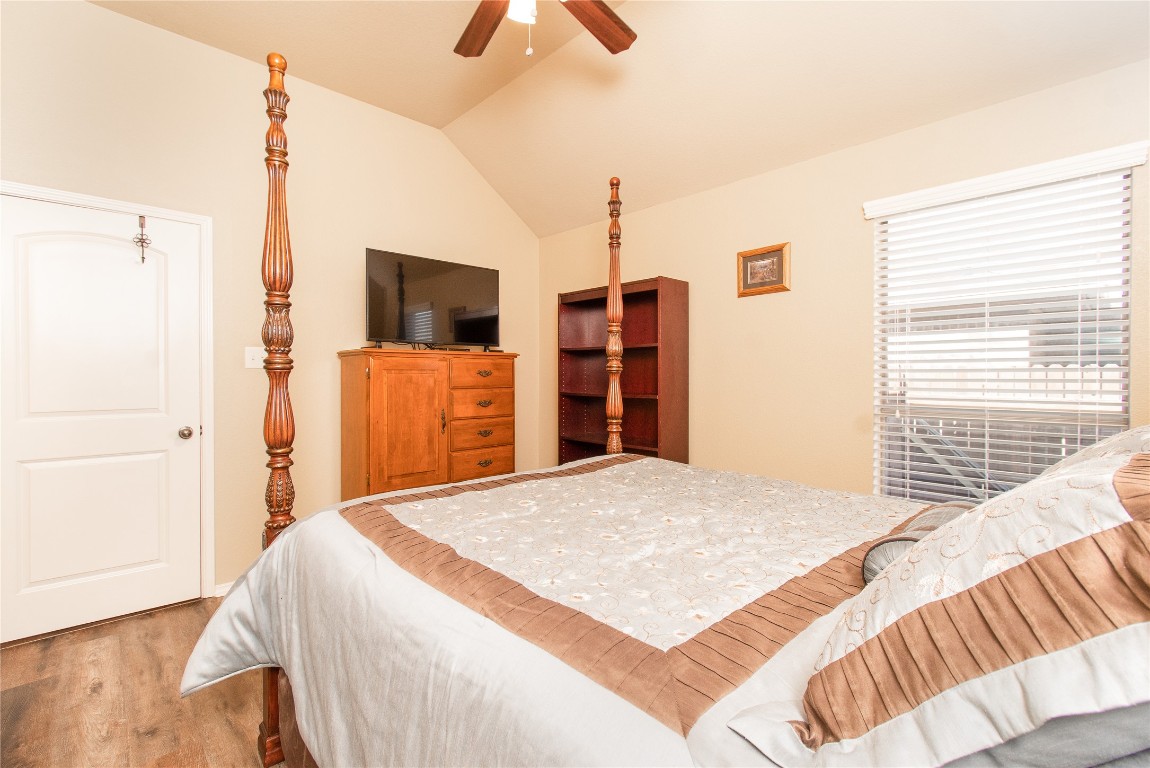 947 Madrone Drive Georgetown, TX 78628 - Photo 21 of 32 a bedroom with a bed and a flat screen tv