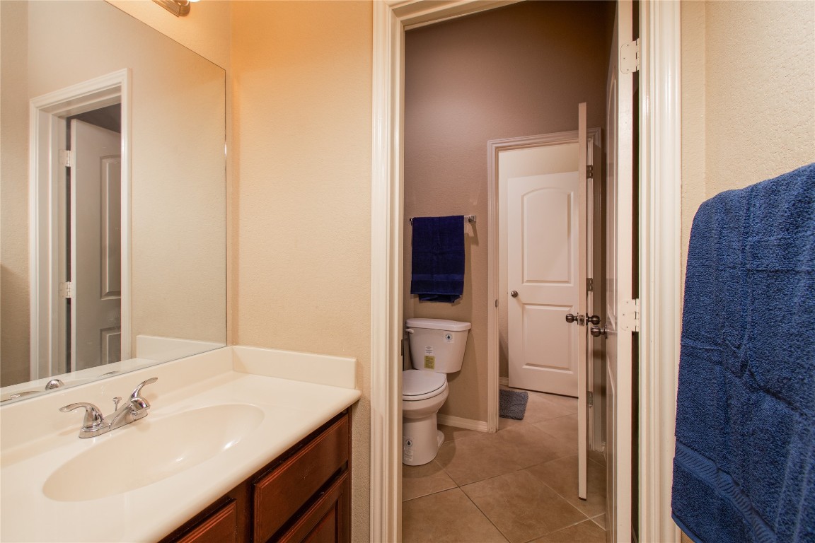 947 Madrone Drive Georgetown, TX 78628 - Photo 23 of 32 a bathroom with a sink a toilet and shower