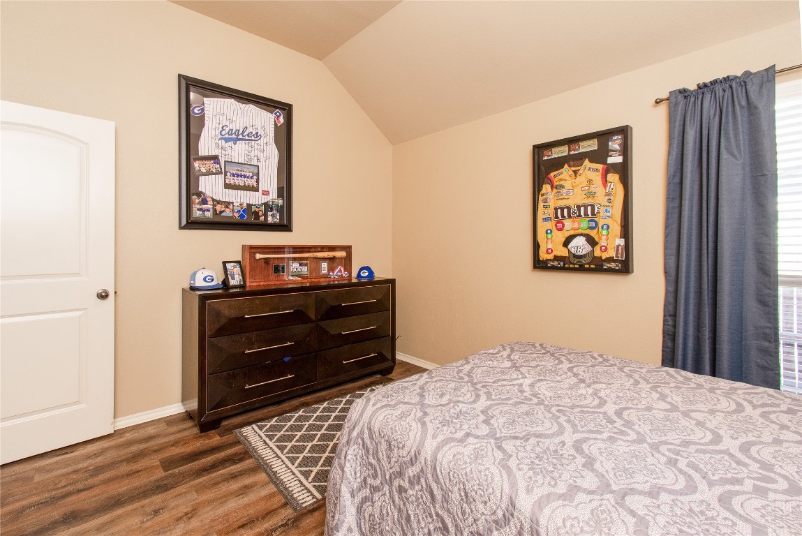 947 Madrone Drive Georgetown, TX 78628 - Photo 27 of 32 a bedroom with a bed and painting on the wall
