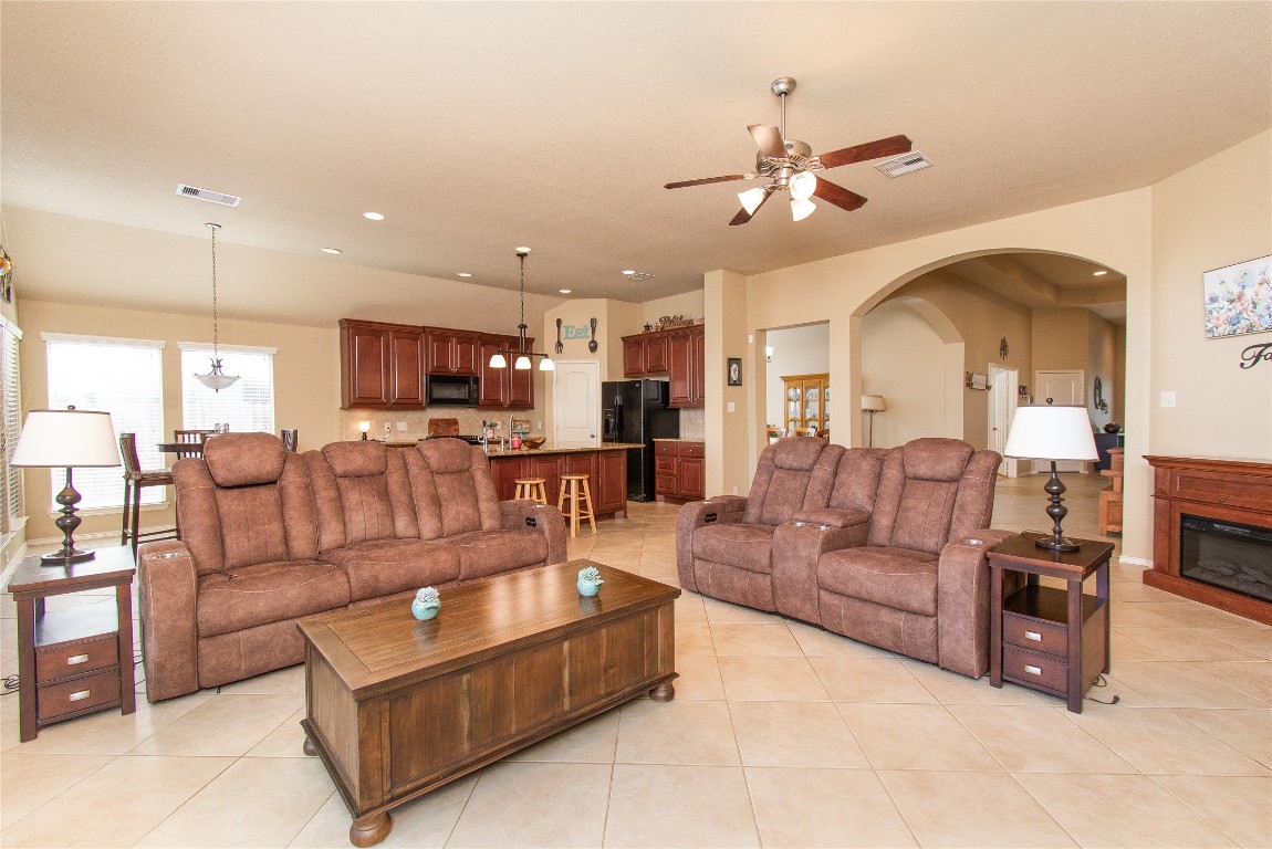 947 Madrone Drive Georgetown, TX 78628 - Photo 5 of 32 a living room with furniture kitchen view and a chandelier