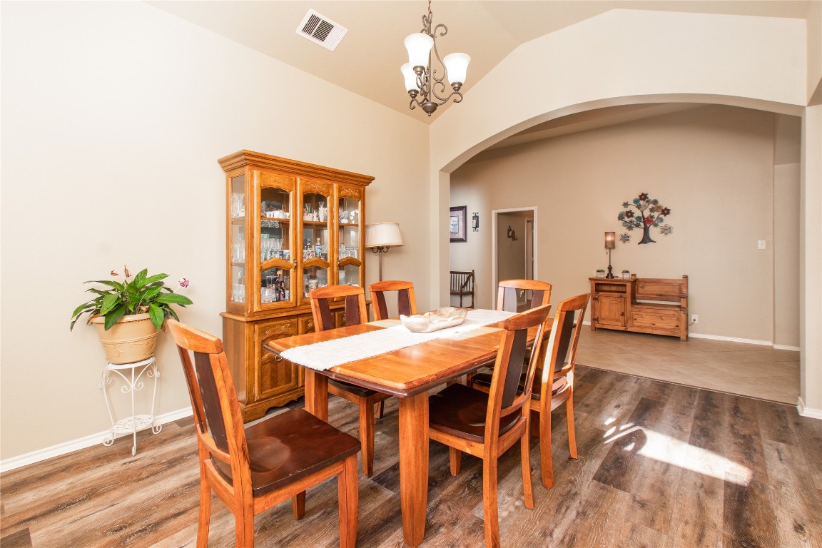 947 Madrone Drive Georgetown, TX 78628 - Photo 8 of 32 a view of a dining room with furniture and a chandelier