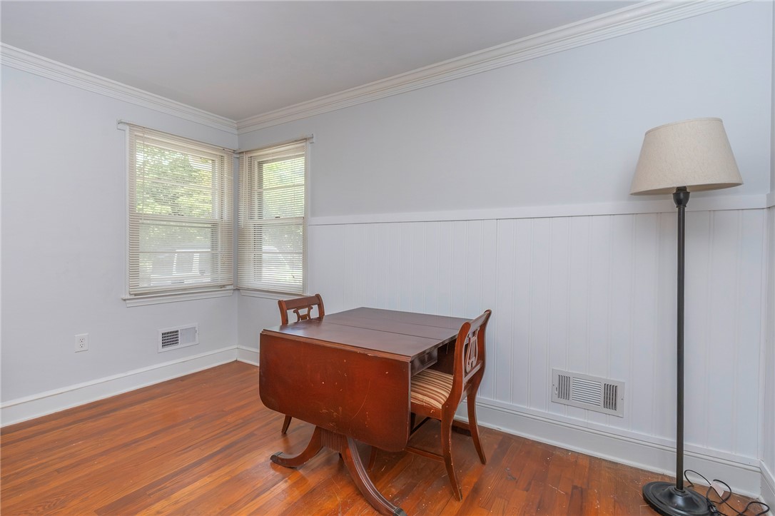 1218 Bolt Drive Anderson, SC 29621 - Photo 12 of 46 Rich hardwood flooring and crisp wainscoting define this inviting, naturally lit space.
