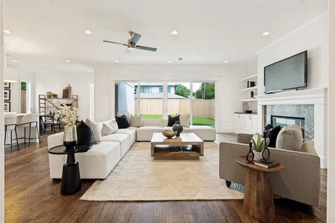 a living room with furniture fireplace and a flat screen tv
