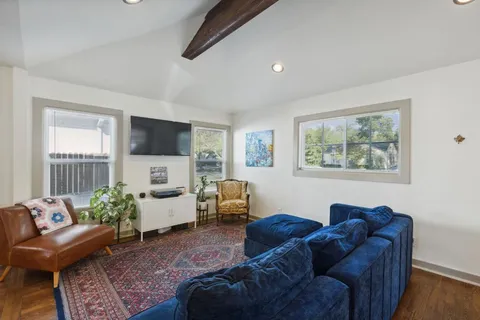 a living room with furniture or couch and a flat screen tv