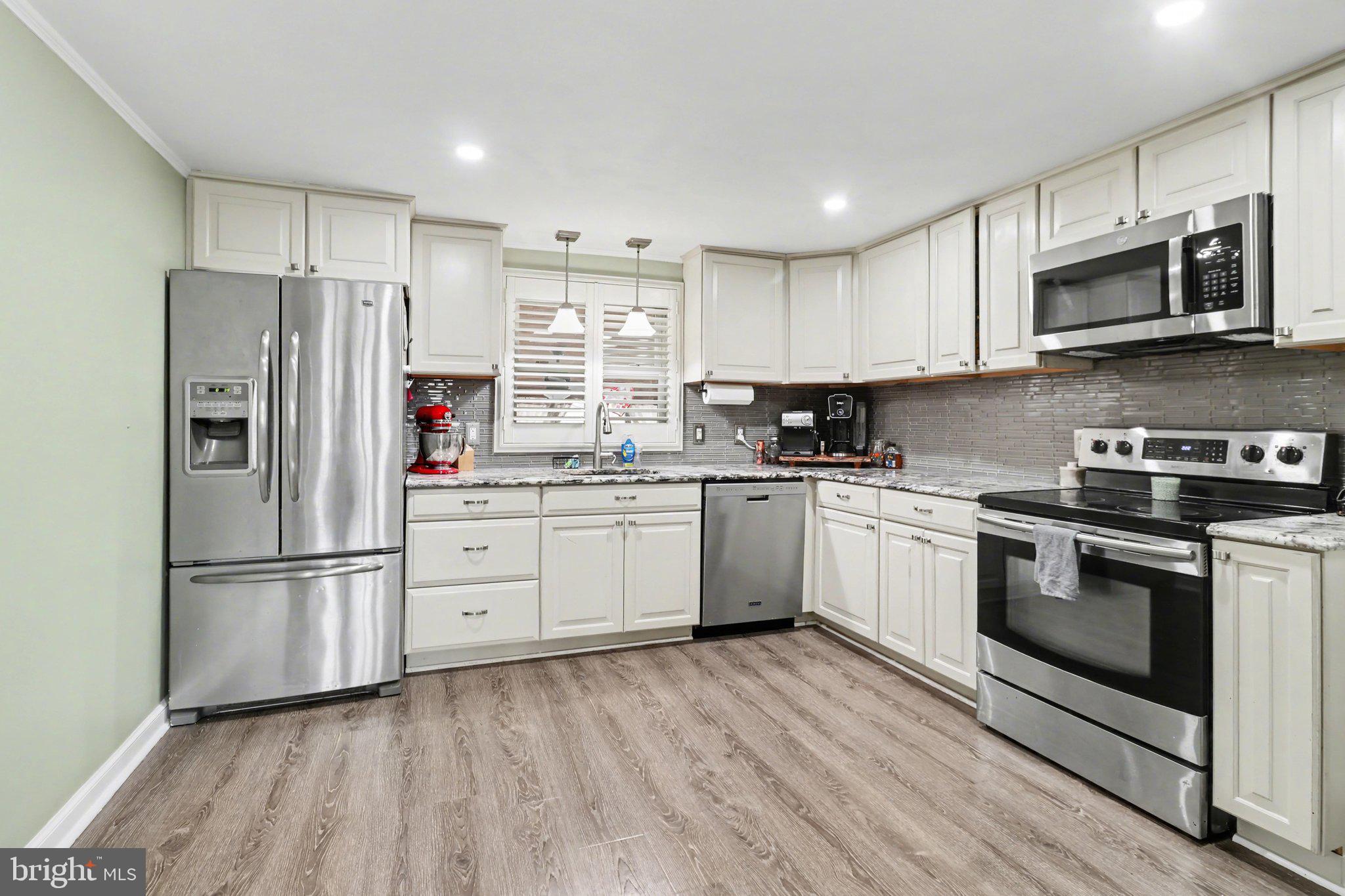 609 North Franklin Street Pottstown, PA 19464 - Photo 11 of 41 a kitchen with stainless steel appliances a refrigerator sink and microwave