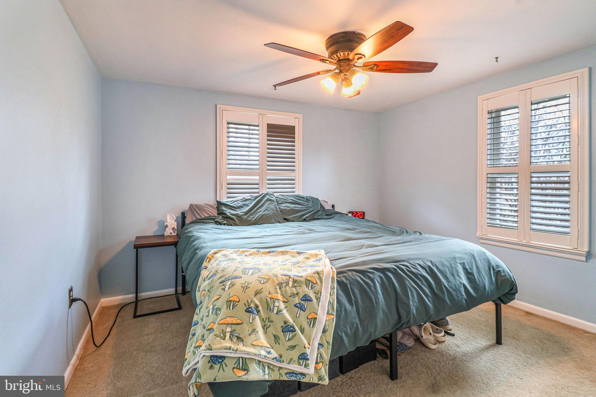 609 North Franklin Street Pottstown, PA 19464 - Photo 15 of 41 a bedroom with a bed and a chandelier