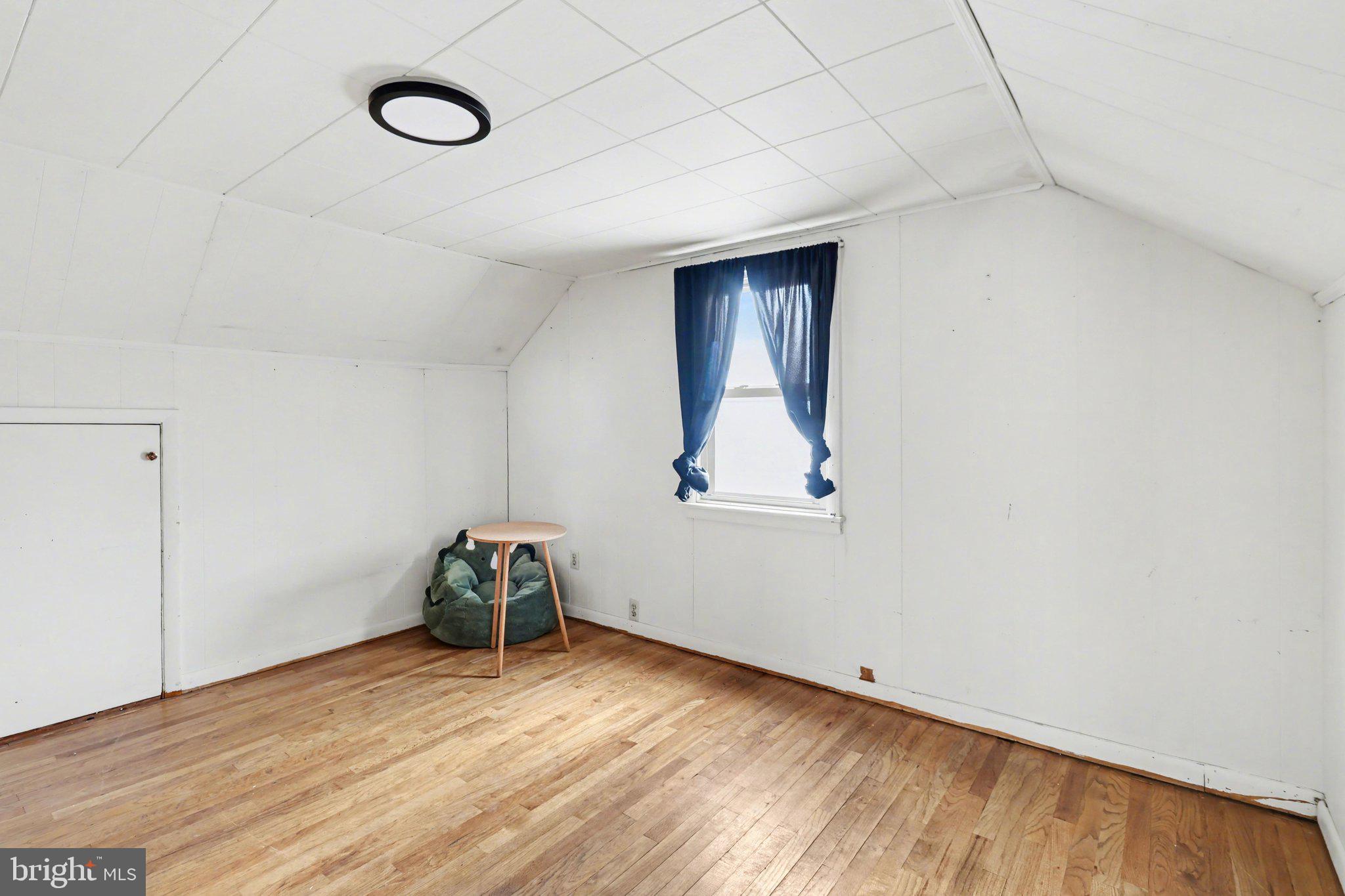 609 North Franklin Street Pottstown, PA 19464 - Photo 21 of 41 a room with a wooden floor and a window