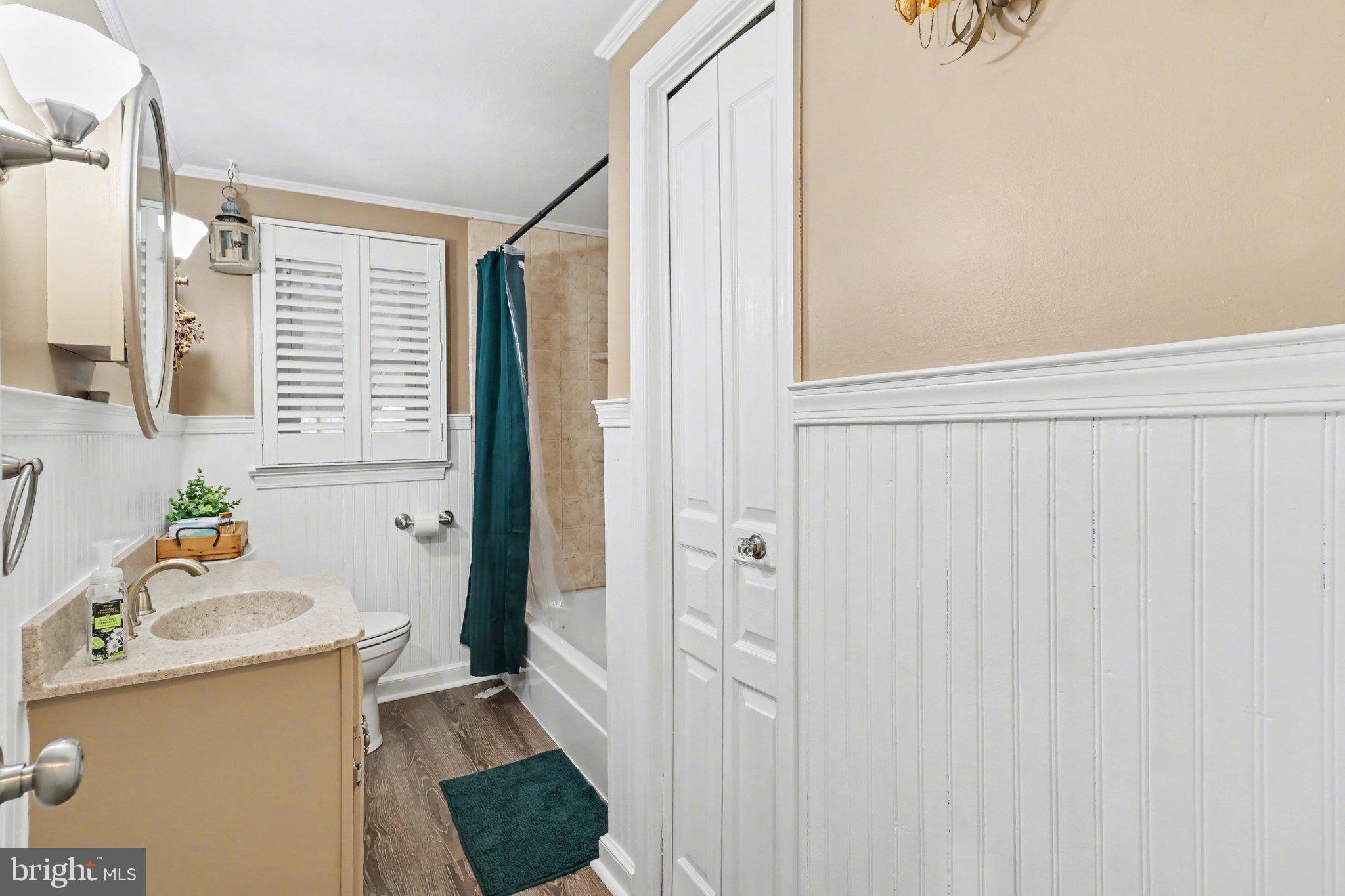 609 North Franklin Street Pottstown, PA 19464 - Photo 26 of 41 a bathroom with a sink a toilet and shower curtain