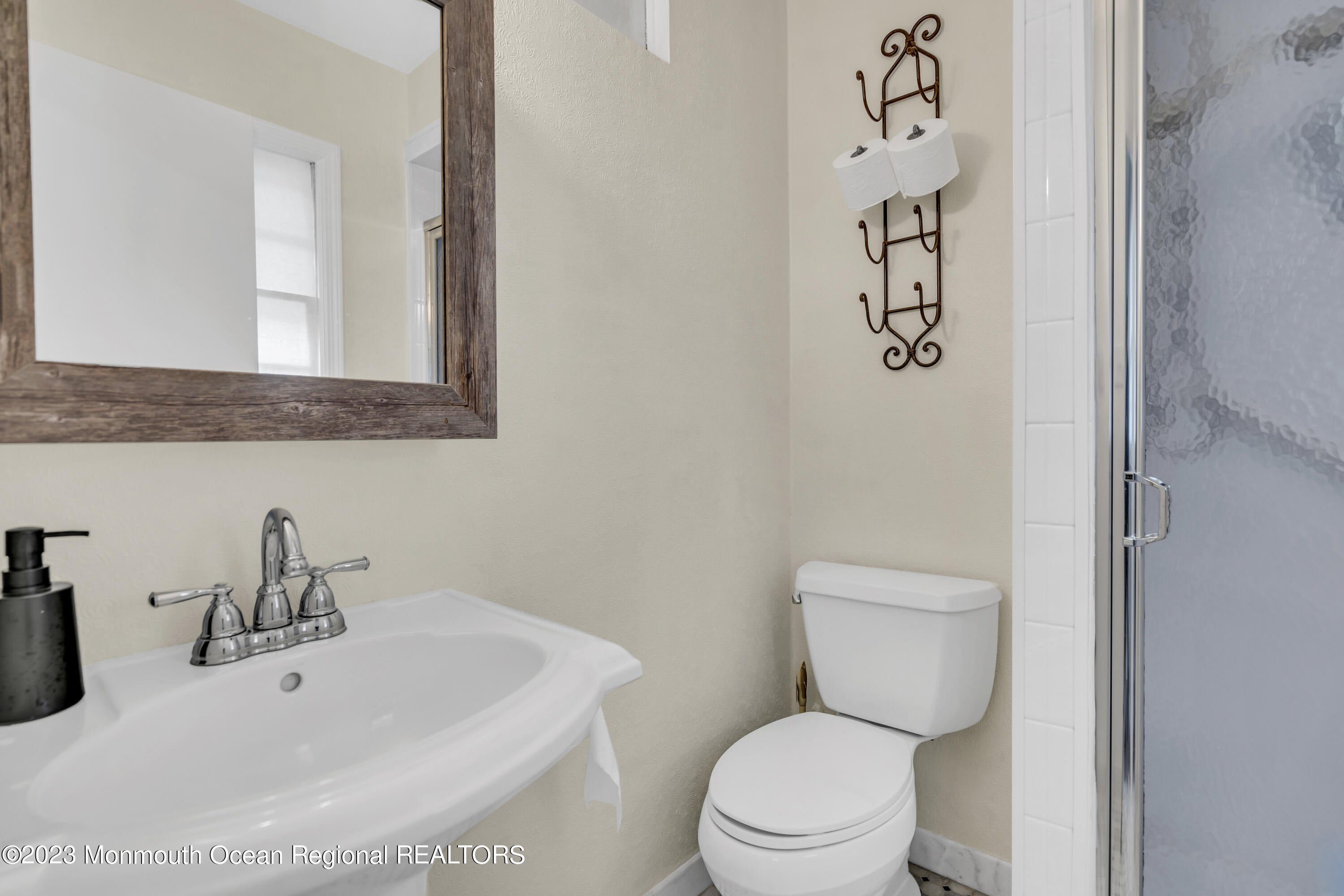 3 Alvord Street Oakhurst, NJ 07755 - Photo 13 of 20 a bathroom with a toilet sink and mirror