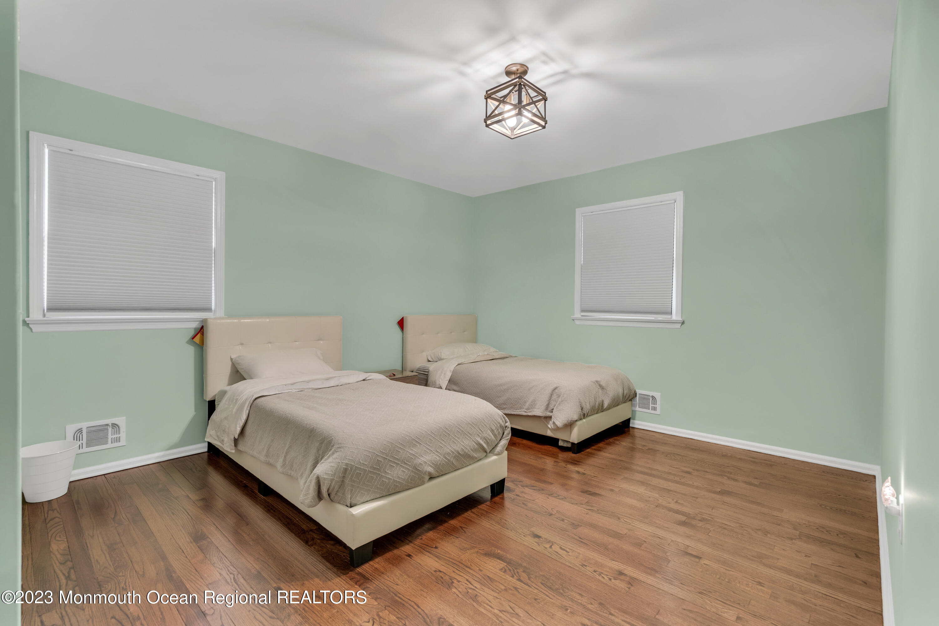 3 Alvord Street Oakhurst, NJ 07755 - Photo 14 of 20 a bedroom with two beds and painting on the wall