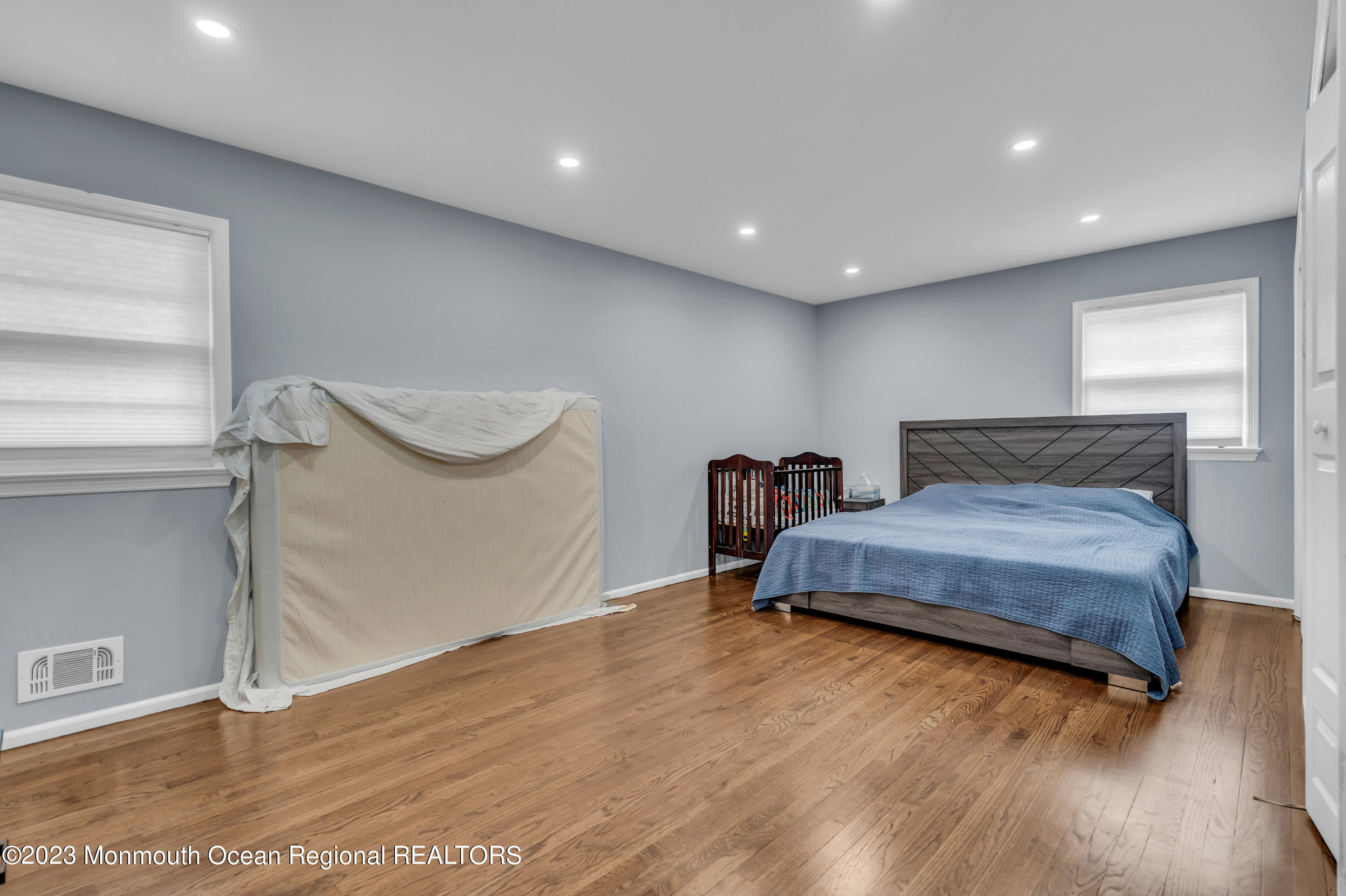 3 Alvord Street Oakhurst, NJ 07755 - Photo 15 of 20 a spacious bedroom with a bed and a table