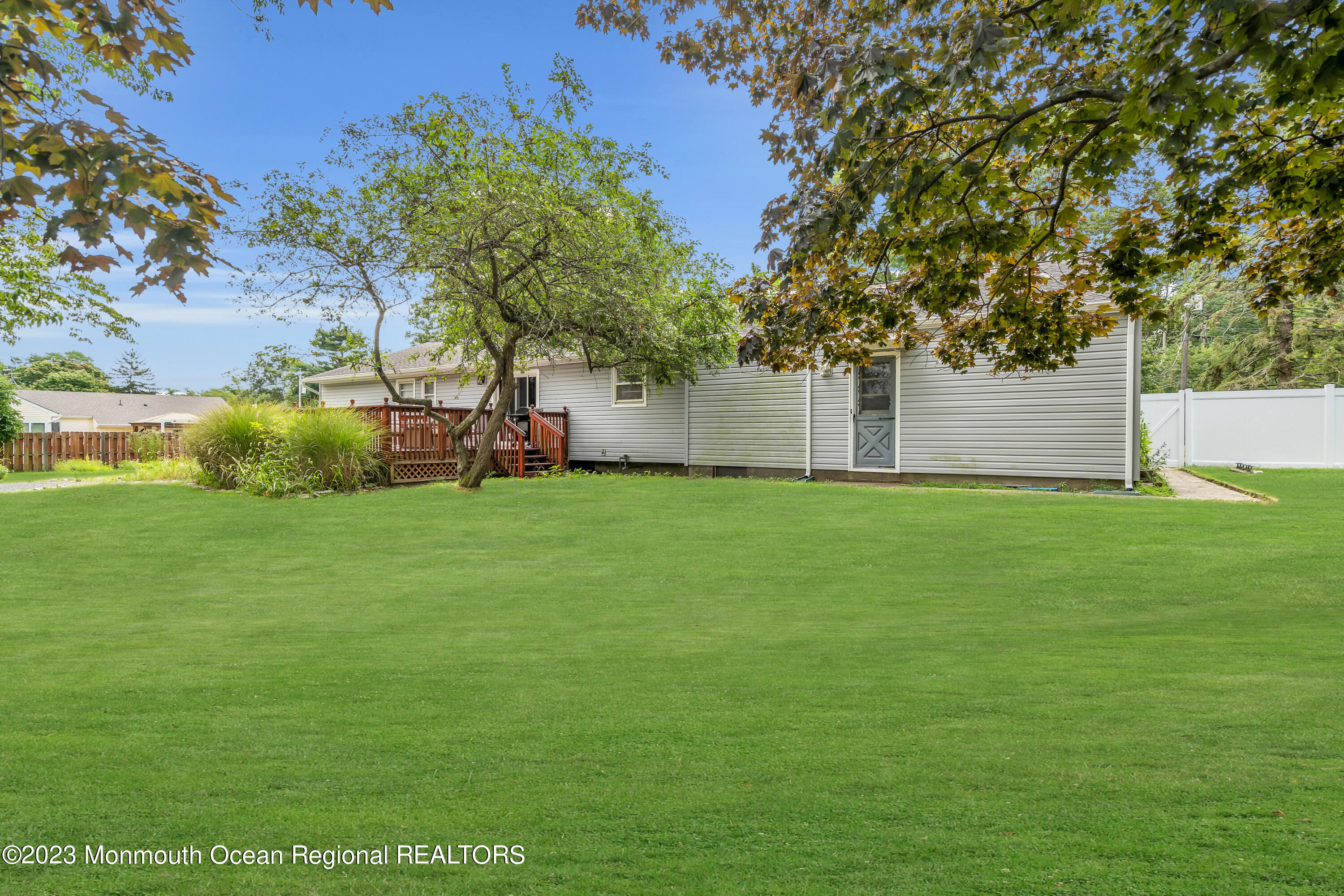 3 Alvord Street Oakhurst, NJ 07755 - Photo 20 of 20 a garden with trees in front of it
