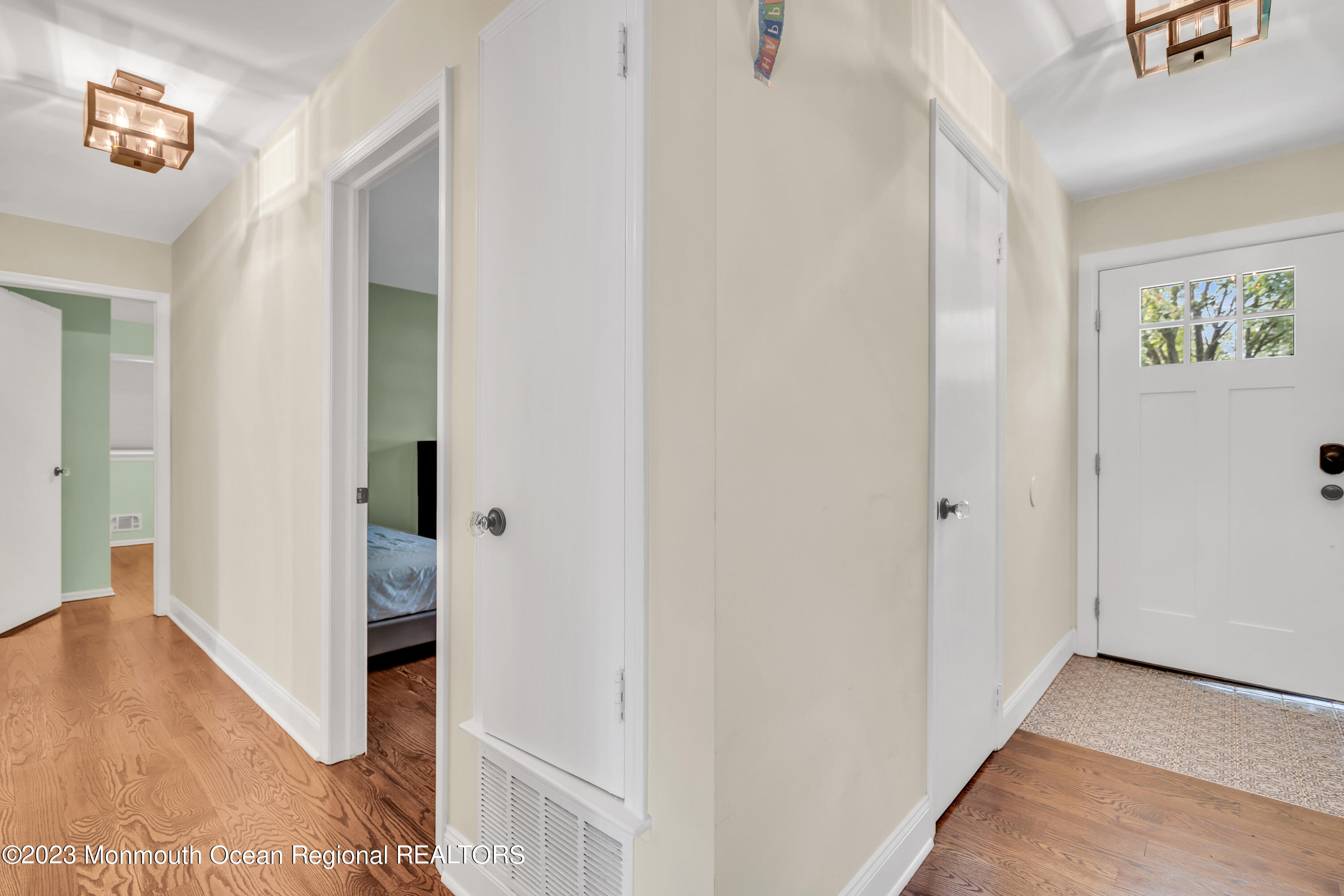 3 Alvord Street Oakhurst, NJ 07755 - Photo 4 of 20 a view of a hallway with wooden floor and closet