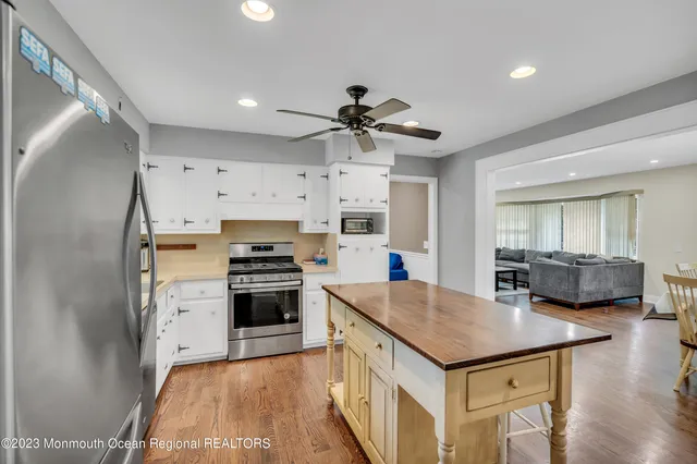 a kitchen with a stove a sink and a refrigerator