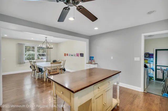 a kitchen with a table and chairs in it