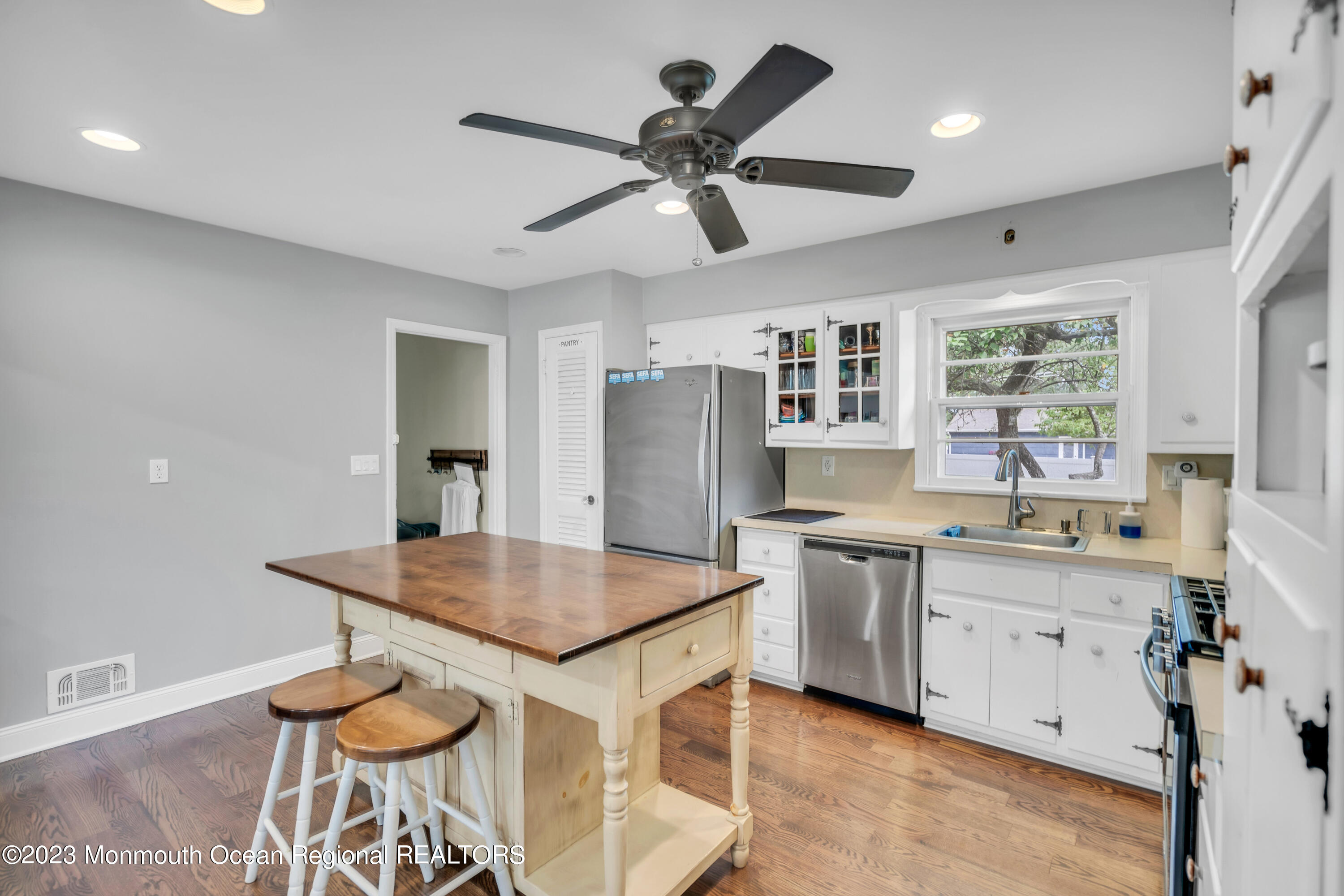 3 Alvord Street Oakhurst, NJ 07755 - Photo 10 of 20 a kitchen with a table chairs sink and cabinets