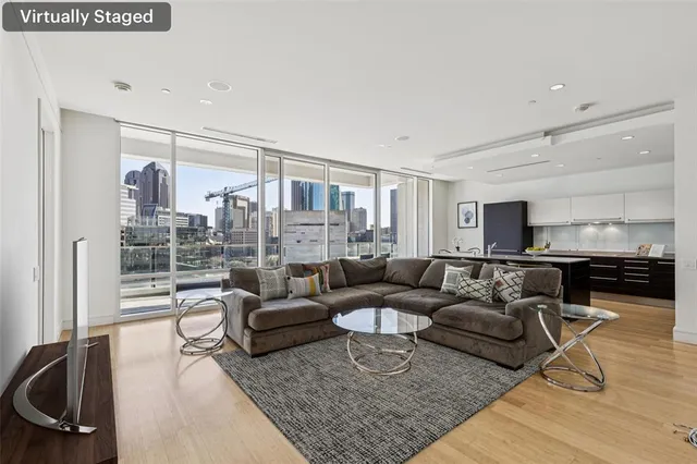 a living room with furniture and a large window