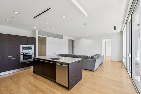 a kitchen with granite countertop a sink and counter top space