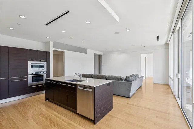 a kitchen with granite countertop a sink and counter top space