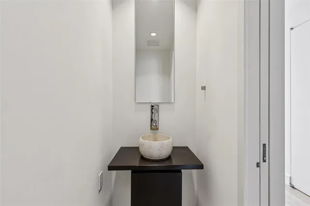 a bedroom with a bed and a potted plant