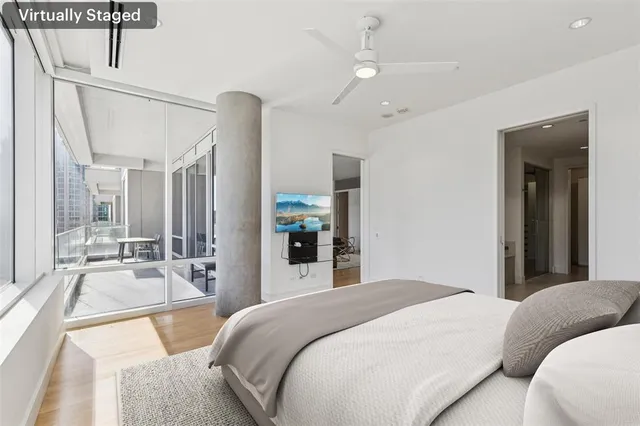 a bathroom with a granite countertop sink a mirror and a shower