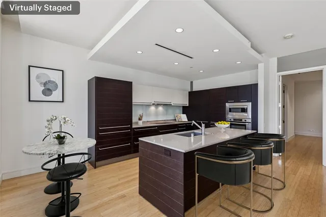 a dining room with furniture and wooden floor