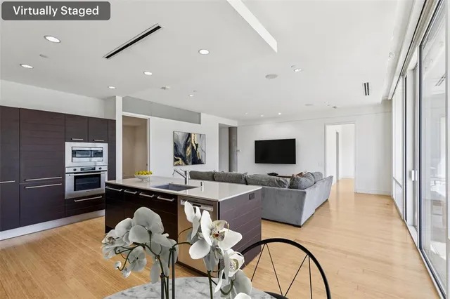 a kitchen with stainless steel appliances a sink stove and refrigerator
