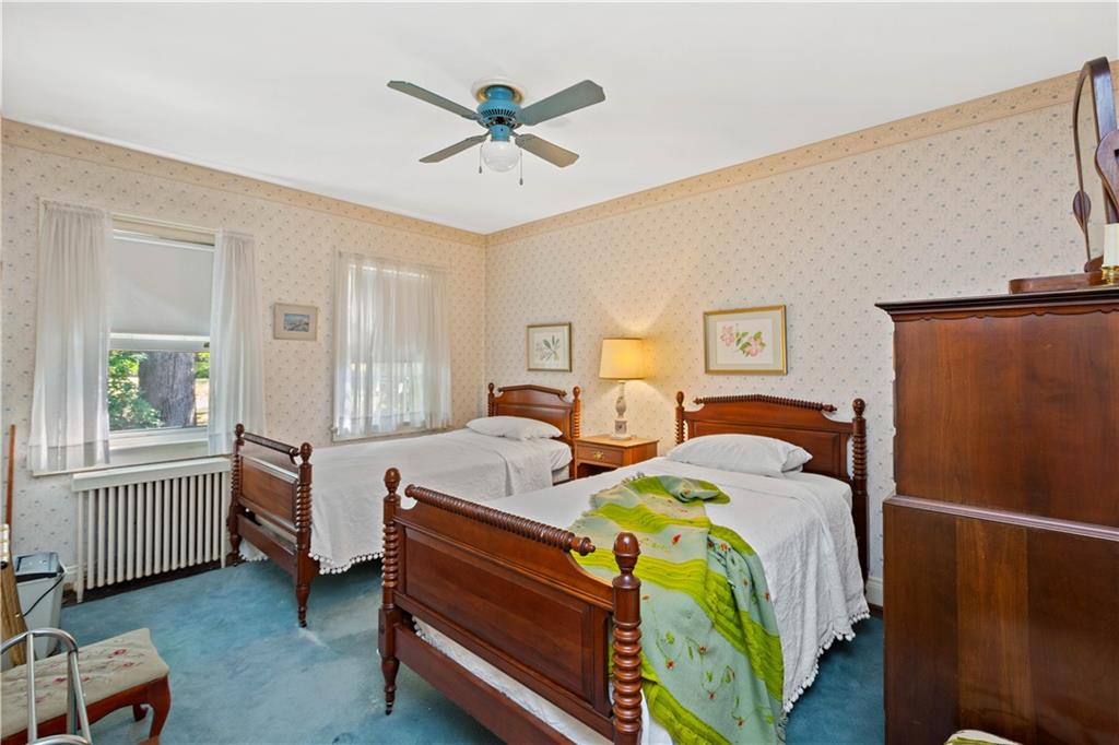 633 Olympia Road Pittsburgh, PA 15211 - Photo 17 of 25 a bedroom with a bed and a window