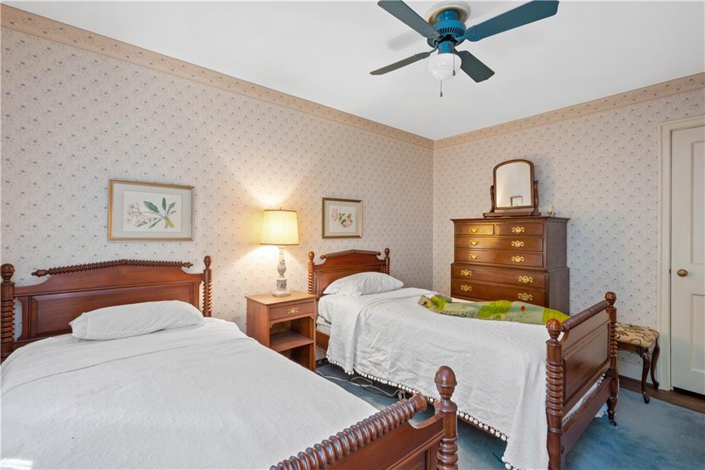 633 Olympia Road Pittsburgh, PA 15211 - Photo 18 of 25 a bedroom with two beds and painting on the wall