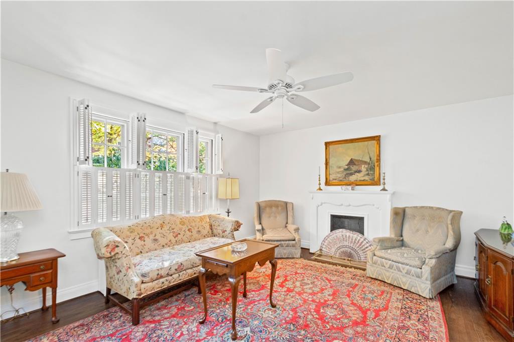 633 Olympia Road Pittsburgh, PA 15211 - Photo 6 of 25 a living room with furniture a rug and a fireplace