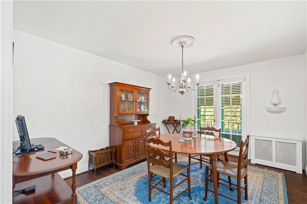 633 Olympia Road Pittsburgh, PA 15211 - Photo 8 of 25 a dining room with furniture a chandelier and wooden floor