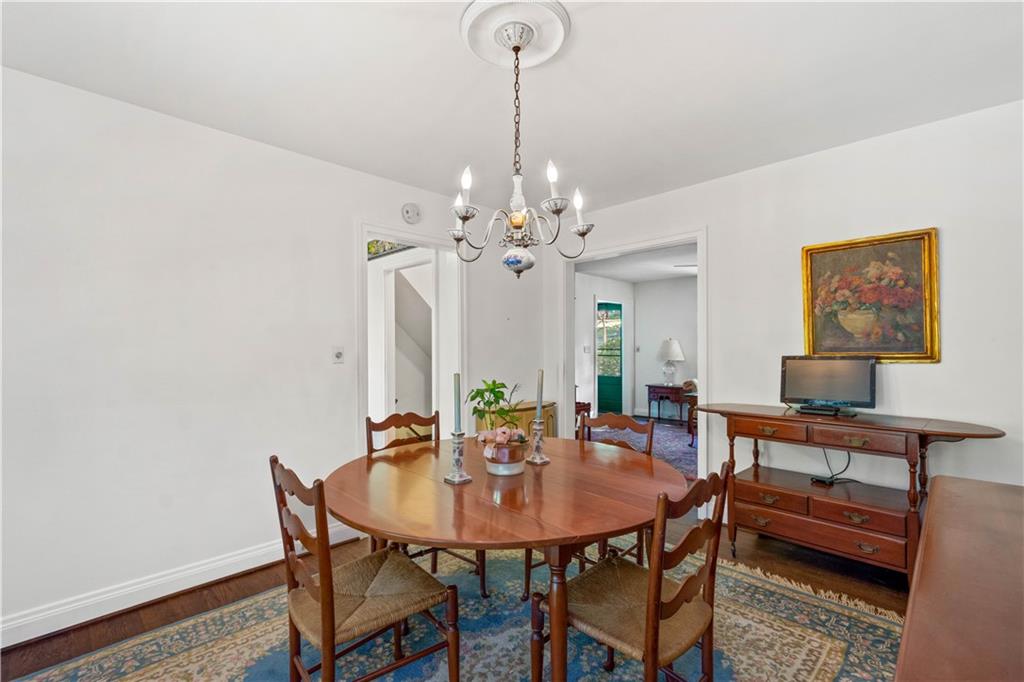 633 Olympia Road Pittsburgh, PA 15211 - Photo 9 of 25 a view of a dining room with furniture and chandelier